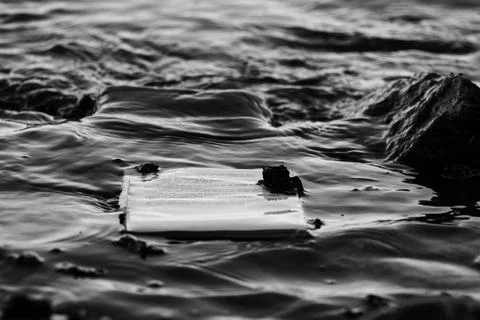 Book floating in water Stock Photos