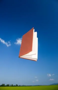 Book flying in the sky Stock-Fotos