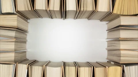 Book frame, stop motion. Top view books forming a frame for text in the middle. Stock Footage 84815563