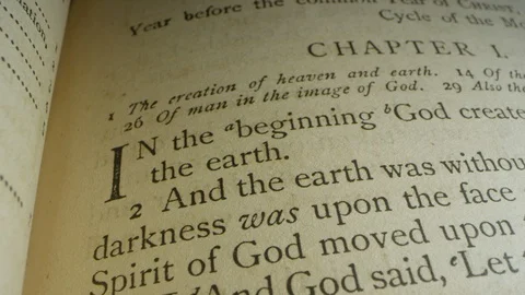 Book of Genesis Chapter 1:1 creation verse, & Old Testament Bible leather cover Stock Footage
