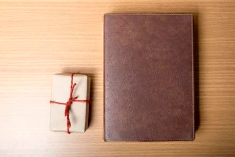 Book with gift box Stock Photos