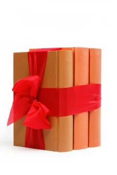Book as a gift. A stack of books on a white background. Stockfoto's