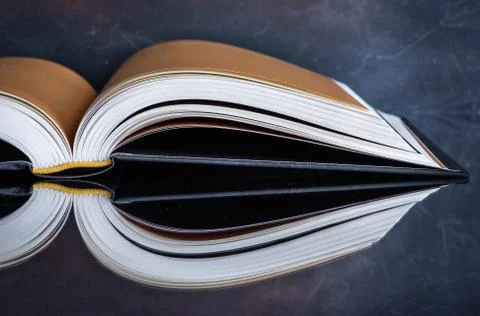 Book on glass table with mirror reflection Stock Photos