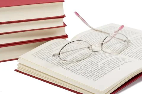 Book with glasses on it Stock Photos