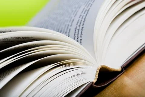 Book on green background Stock Photos