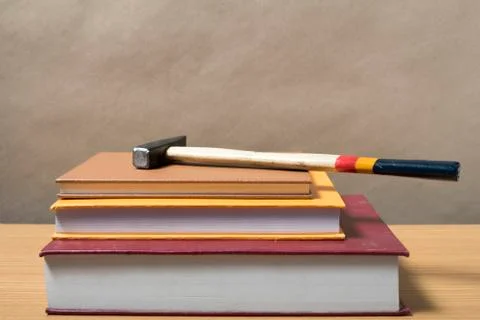 Book with hammer Stock Photos