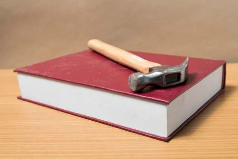 Book with hammer Stock Photos