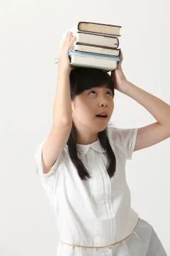 Book on her head Stock Photos