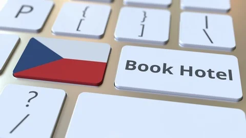 BOOK HOTEL text and flag of the Czech Republic on the buttons on the computer Stock Footage 112460604