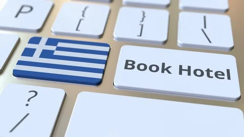 BOOK HOTEL text and flag of Greece on the buttons on the computer keyboard Stock Footage 112465415
