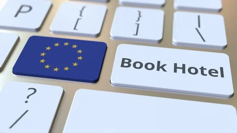 BOOK HOTEL text and flag of the European Union on the buttons on the computer Stock Footage 112466804