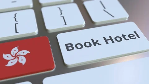 BOOK HOTEL text and flag of Hong Kong on the buttons on the computer keyboard Video stock 112468232