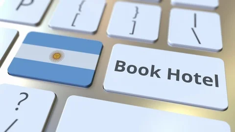 BOOK HOTEL text and flag of Argentina on the buttons on the computer keyboard Stock Footage 112483598