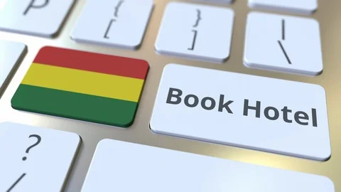 BOOK HOTEL text and flag of Bolivia on the buttons on the computer keyboard Stock Footage 112484666