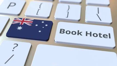 BOOK HOTEL text and flag of Australia on the buttons on the computer keyboard Stock Footage 112485396