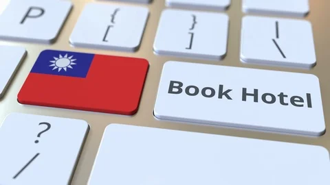 BOOK HOTEL text and flag of Taiwan on the buttons on the computer keyboard Stock Footage 112489947