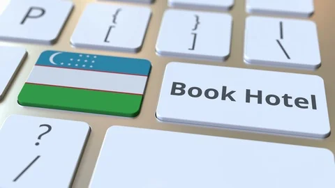 BOOK HOTEL text and flag of Uzbekistan on the buttons on the computer keyboard Stock Footage 112491803