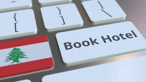 BOOK HOTEL text and flag of Lebanon on the buttons on the computer keyboard Stock Footage 112500752