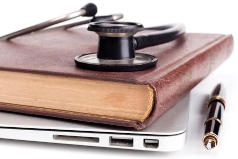 Book on Laptop Stock Photos