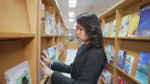 Book at the library Video stock 150402469