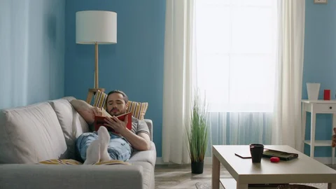 Book-Lover Has a Pause from Gadgets Stock Footage 129887697