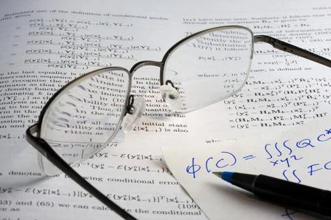 Book, math, glasses, hadwritten notes Study or research concept - book wit... Stock Photos