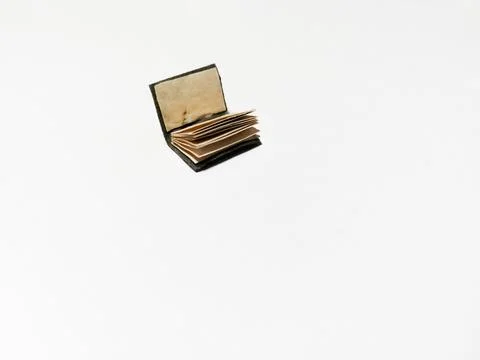 The book is in miniature format on a white background. Stock Photos