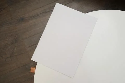 Book mockup on coffee table soft light Stock Photos