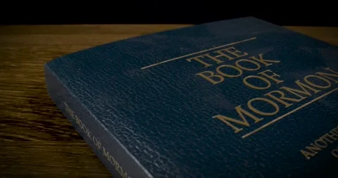 Book of Mormon Cover Macro Pan Right Stock Footage 288230310