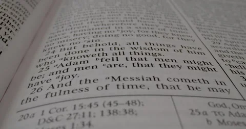 Book of Mormon Macro Text 2 Nephi 25 Adam Fell Tilt Down Video stock 288229469