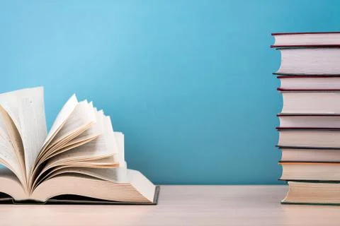 The book is open, lying on the table, the sheets spread out like a fan on a b Stock Photos