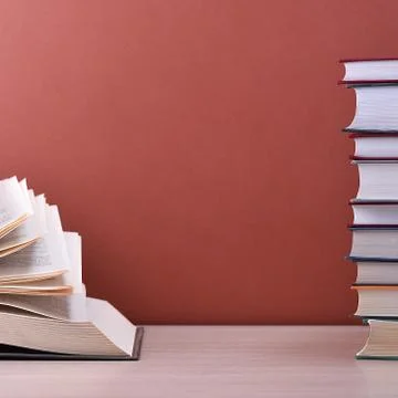The book is open, lying on the table, the sheets spread out like a fan on a b 스톡 사진