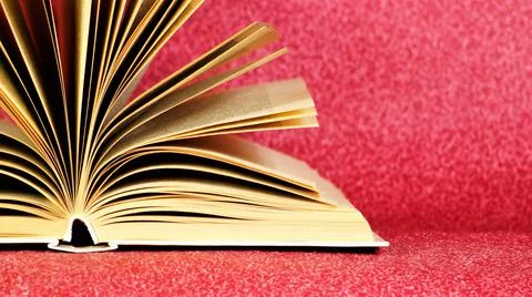 The book is open, a source of important knowledge. Stock Photos