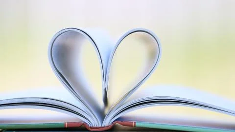 Book page in heart shape Stock Photos