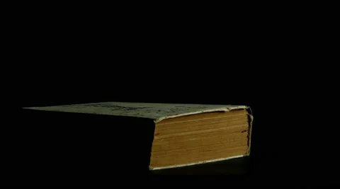 Book page turning on black background 4k footage Stock Footage 53932934