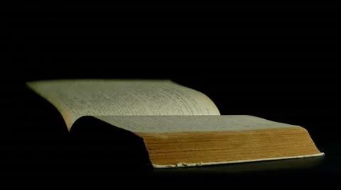 Book page turning on black background 4k footage Stock Footage 53934414