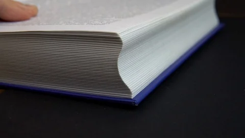 Book pages turning in slow mo Stock Footage 100295124
