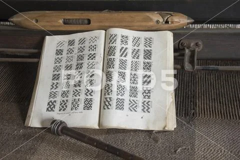 Book of patterns on loom Stock Photos