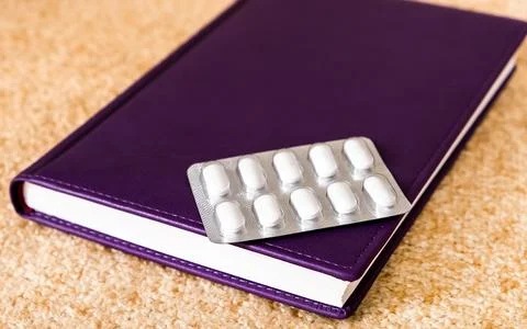Book with a Pills Stock Photos