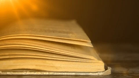 Book in the rays of light. 스톡 동영상 94322759