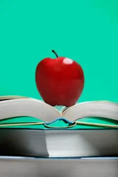 Book with red apple Stock Photos