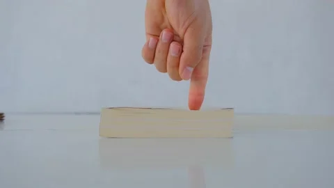 Book reflection on white table. Video stock 195074970