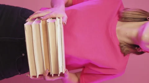 Book shop advertisement back to school woman pile Stock Footage 170065853