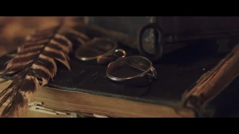 Book, Spectacles, Feather &amp; Key Slider Shot 스톡 동영상 81884486