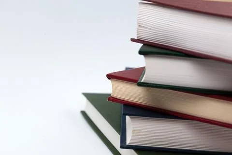 Book stack on a white background. Education concept side view close up Stock Photos