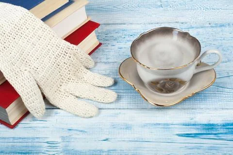 Book stacking. Open book, hardback books on wooden table and blue backgroun.. Stock Photos