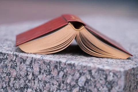 Book on a stone table Stock Photos