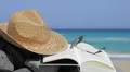 Book, sunglasses and straw hats on the beach. Relax concept HD Footage