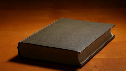 Book on the table camera moving backwards Stock Footage
