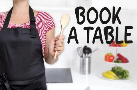 Book a table cook holding wooden spoon concept 스톡 사진